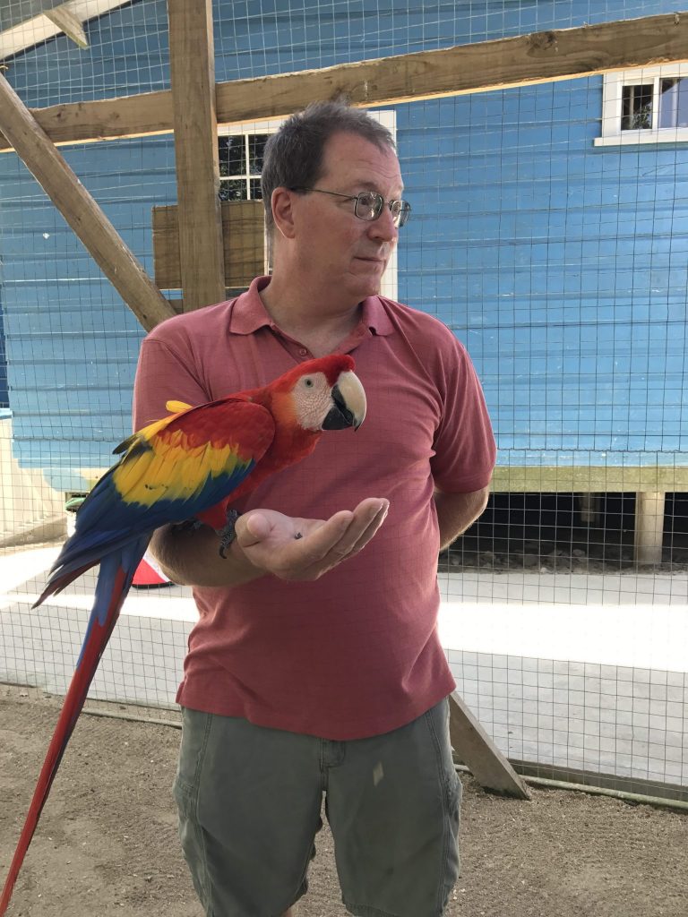 Kev Holding a Macaw